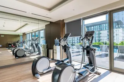 a gym with cardio equipment in a building at Stunning I Biggest Studio I Near To Downtown in Dubai