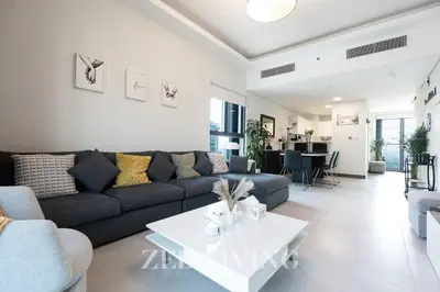 a living room with a couch and a table at Sol Bay - Stay in style with Burj Khalifa views - Zed Living in Dubai