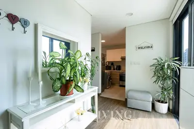 a living room with potted plants on a table at Sol Bay - Stay in style with Burj Khalifa views - Zed Living in Dubai