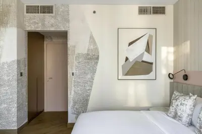 a bedroom with a bed and a picture on the wall at Luxury 4 Bedroom Penthouse in Dubai Marina in Dubai