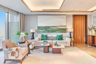 a living room with a couch and a table at Premium 5 bedroom penthouse opposite Burj Khalifa in Dubai