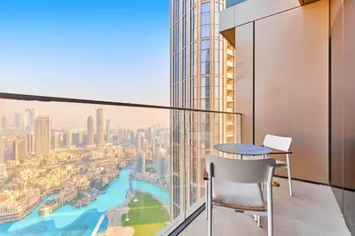 a balcony with a table and a view of a city at Premium 5 bedroom penthouse opposite Burj Khalifa in Dubai