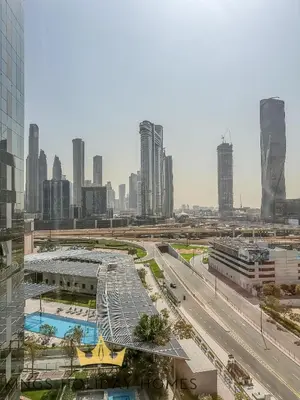 a view of a city with a highway and buildings at Central Park towers residence difc in Dubai