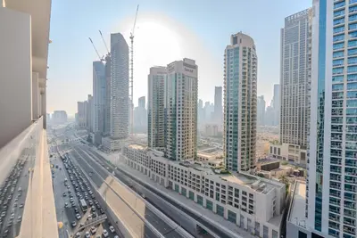 a view of a city with tall buildings and cars at TRPS - MAG 318, Business Bay - Spacious Studio, Furnished, Close to Dubai Mall in Dubai