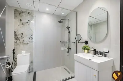 a bathroom with a shower and a toilet and a sink at Vogue Arjan Opalz by Danube near Science Park, One Bedroom Apartment with Balcony and Vibrant Community View, Access to all Amenitties in Dubai