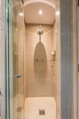 a shower with a glass door in a bathroom at Charming 1 BR with Burj Khalifa View in Dubai