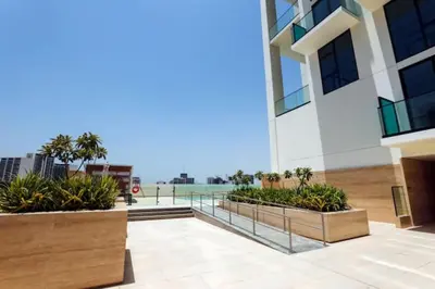 a balcony of a building with some plants at Vogue JVC Binghatti Dawn near Circle Mall, Studio Apartment with Balcony and Vibrant Community View, Access to all Amenities in Dubai