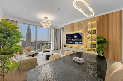 a living room with a black table and a couch at 3 Bedroom in Creek Habour with Scenic Views for Family and Solo Travelers in Dubai