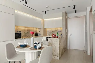 a kitchen and dining room with a table and chairs at The Smart Concierge - Bay Central in Dubai