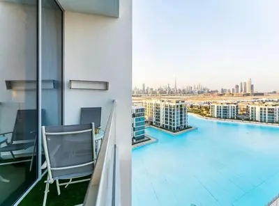 a balcony of a building with a view of a city at Vacationer l Stunning 1 Bed l Private Beach l near Downtown in Dubai