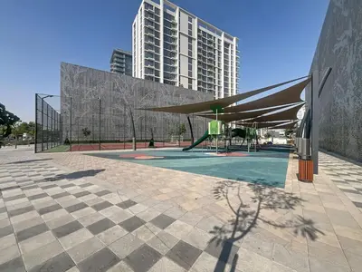 a building with a basketball court in a courtyard at Vacationer l Stunning 1 Bed l Private Beach l near Downtown in Dubai