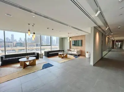 a living room with a couch and a table at Vacationer I Luxury 3 Bedroom Apartment I Iconic Burj Khalifa View I Heart of Downtown in Dubai