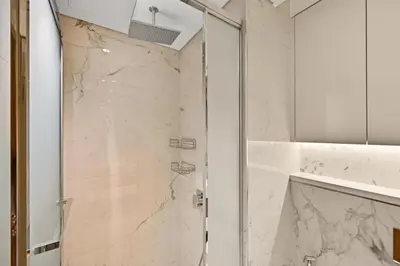 a shower with a glass door in a bathroom at Estudio Rimal en Dubái por beBalmy in Dubai