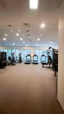 a gym with several exercise bikes in a room at Luxury Family Friendly Apartment - Full Burj Khalifa & Fountain Views in Dubai