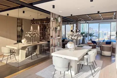 a living room with a dining table and chairs at PVH - Sleek 1BR near Community Park - Pearl House 1 in Dubai
