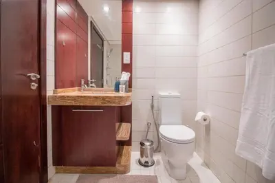 a bathroom with a toilet and a sink at Studio at Burj Views L246 in Dubai