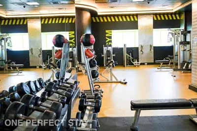 a gym with cardio equipment in a gym at 1BR Elite Residence4304 in Dubai