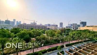 a view of a city with a one perfect star sign at 1BR Diamond Views 403A in Dubai
