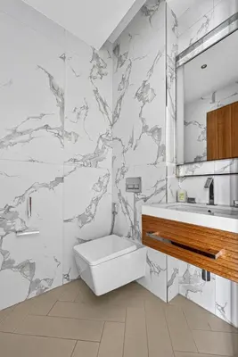 a bathroom with a toilet and a sink at Address Residences Dubai Opera - Boulevard Views 1 & 2 Bedroom Apartment 5 minute walk to Burj Khalifa & Dubai Mall by NAMUVE in Dubai