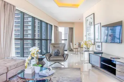 a living room with a couch and a table at 2BR - DAMAC Towers by Paramount - Business Bay in Dubai