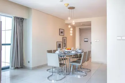 a dining room with a table and chairs at 2BR - DAMAC Towers by Paramount - Business Bay in Dubai
