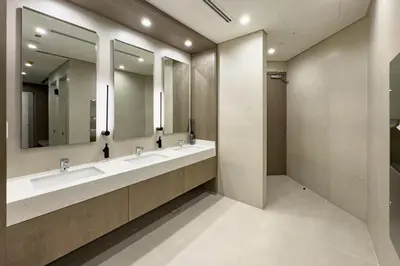 a bathroom with two sinks and two mirrors at High-Floor 1BR Facing the Marina and City, Minutes from Marina Beach with Easy Access to Marine Transport, LIV Marina, Dubai Marina by Deluxe Holiday Homes in Dubai