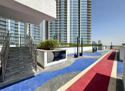 a red white and blue walkway in front of a building at Spacious apartment with Burj Khalifa view close to Dubai mall! in Dubai