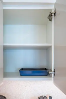 a blue bowl on a shelf in a kitchen at Stunning 1 Bedroom Panoramic Views at Burj Royale in Dubai