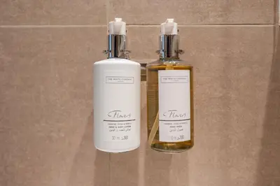 two bottles of essential oils sitting on a counter at Stunning 1 Bedroom Panoramic Views at Burj Royale in Dubai