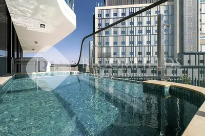 a swimming pool on top of a building at Bloomfields Classic 2Br With Private Pool Samana in Dubai