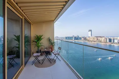a balcony with a view of the water at Skyline Serenity - Luxury Beachfront Living in Dubai