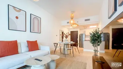 a living room with a couch and a table at MARINA DIAMOND 6 by Design Studio in Dubai