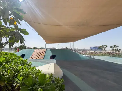 a skate park with a ramp under a canopy at Frank Porter - Golf Gate 1 in Dubai