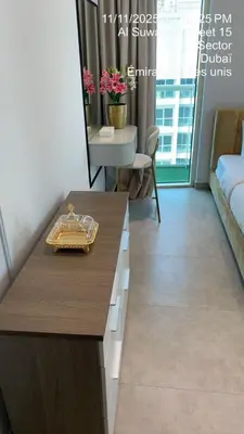 a living room with a table and a mirror at MARINA VIEW TOWER a WING in Dubai