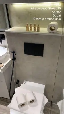 a bathroom with a white toilet and a sink at MARINA VIEW TOWER a WING in Dubai