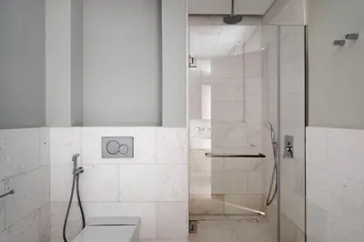 a bathroom with a shower and a toilet at Blueground The Palm Jumeirah jacuzzi nr Atlantis DXB-1708 in Dubai