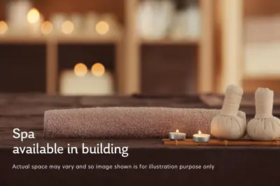 a table with two candles and two small votives at Blueground The Palm Jumeirah jacuzzi nr Atlantis DXB-1708 in Dubai