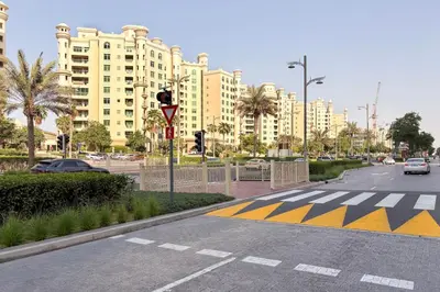 an empty street in a city with tall buildings at Blueground The Palm Jumeirah jacuzzi nr Atlantis DXB-1720 in Dubai