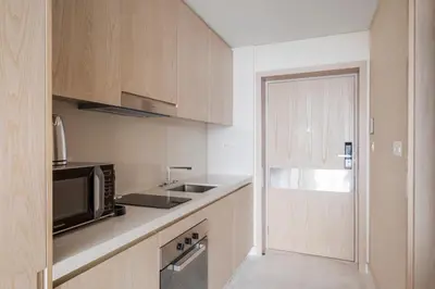 a kitchen with a sink and a microwave at Blueground The Palm Jumeirah jacuzzi nr Atlantis DXB-1720 in Dubai