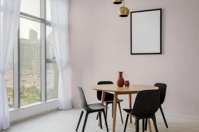 a dining room with a table and chairs and a window at Blueground JLT pool nr Lake DXB-1747 in Dubai