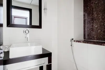 a bathroom with a sink and a mirror at Blueground JLT pool nr Lake DXB-1747 in Dubai