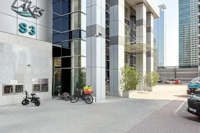 a group of bikes parked outside of a building at Blueground JLT pool nr Lake DXB-1747 in Dubai