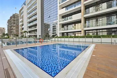 a swimming pool in the middle of a building at Estudio Amira en Dubai by beBalmy in Dubai
