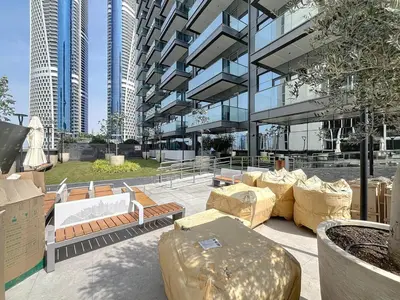 a building with a bunch of benches in front of it at Vacationer l Modern 1 Bedroom l City Views l Prime Location in Dubai
