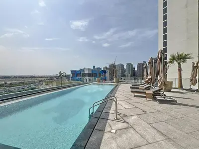 a swimming pool on the roof of a building at Vacationer l Modern 1 Bedroom l City Views l Prime Location in Dubai