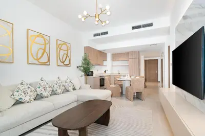 a living room with a couch and a table at Vacay Lettings - Missoni Luxury 2 BR Urban Oasis Dubai Canal View in Dubai