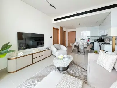 a living room with a couch and a table at Elegant 1BR Unit with Premium Finish in Dubai