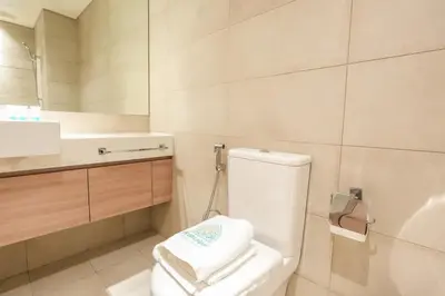 a bathroom with a white toilet and a sink at Stunning - Cozy Studio - Azizi Riviera in Dubai