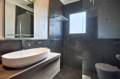a bathroom with a white sink and a mirror at JuliusHomes-Villa Noor in Dubai