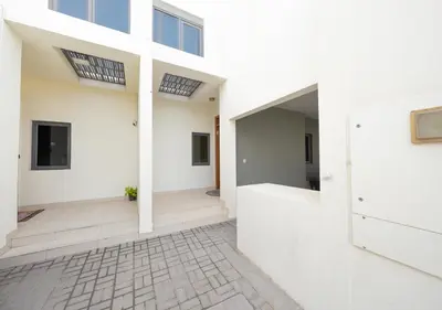 a view of the hallway of a house with white walls at Luxury Maple 3 Villa in Dubai Hills with Private Garden in Dubai